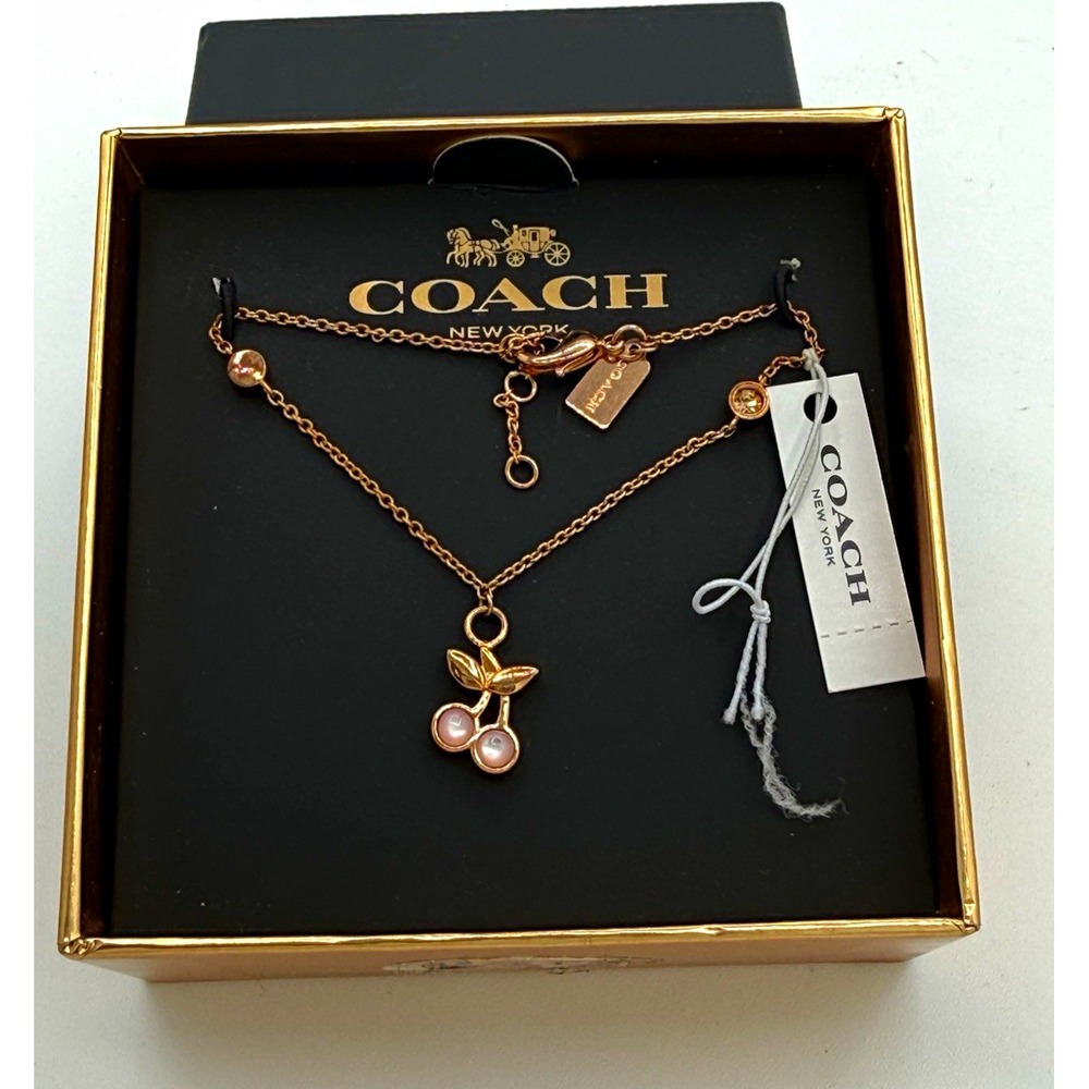 NWT Coach Cherry Charm Pendant Bracelet Gold Tone Pink Adjustable Cable F33365